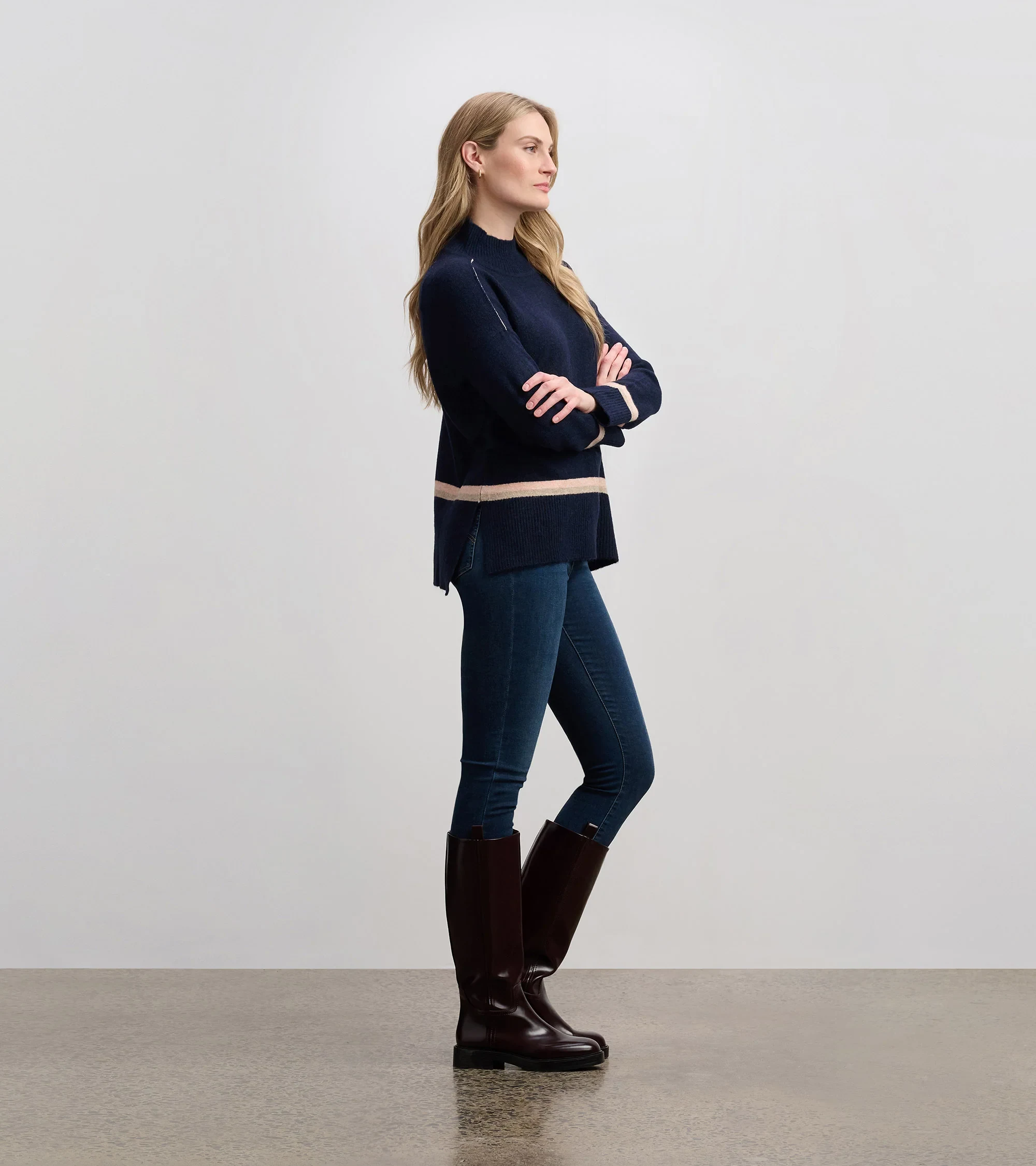 50 Thermal Layering Outfits for Cold January Days That Are Chic, Warm and Elegant 47 White Thermal Top under a Navy Knit Sweater with Blue Jeans and Dark Brown Boots