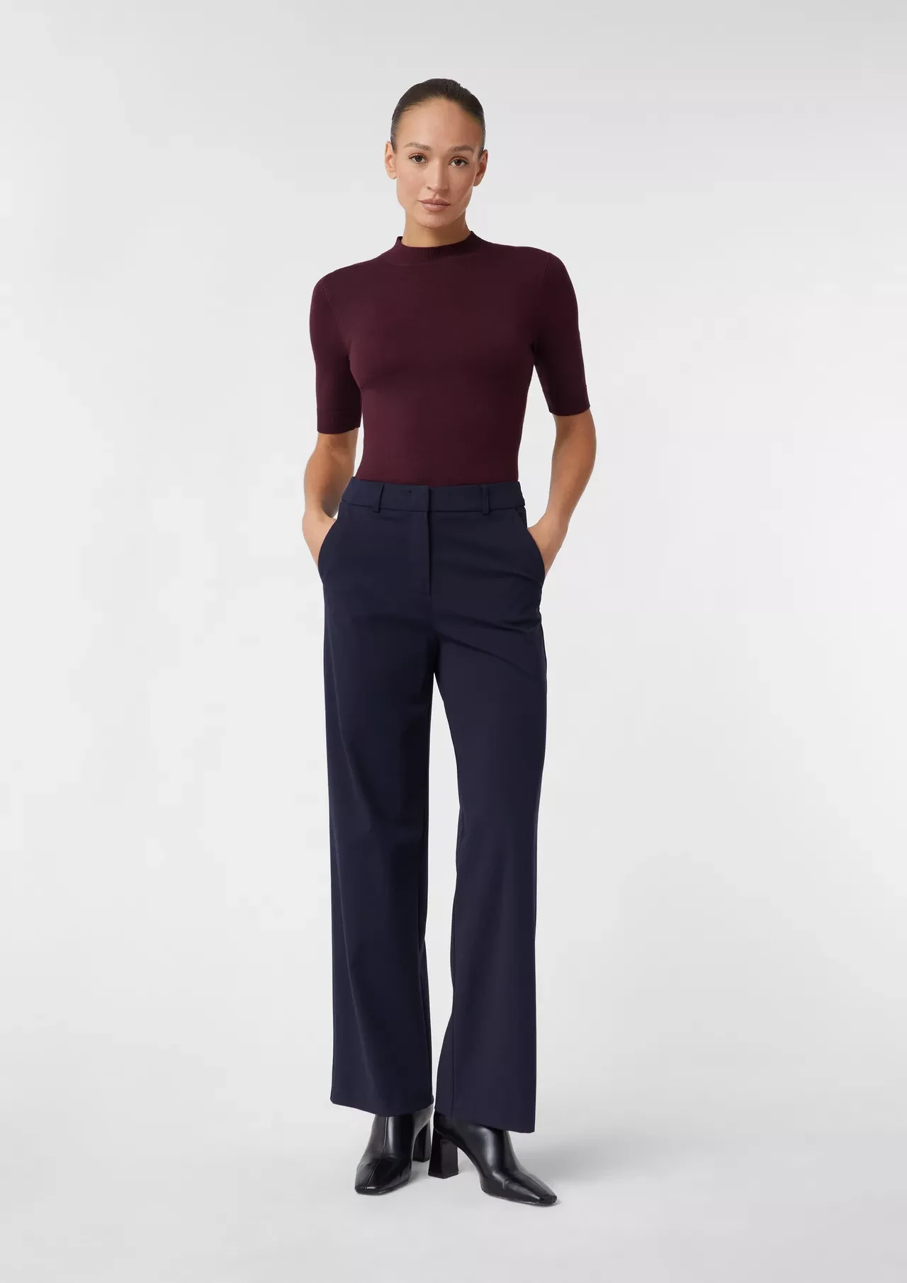 Burgundy Turtleneck with Navy Tailored Trousers and Black Heeled Ankle Boots