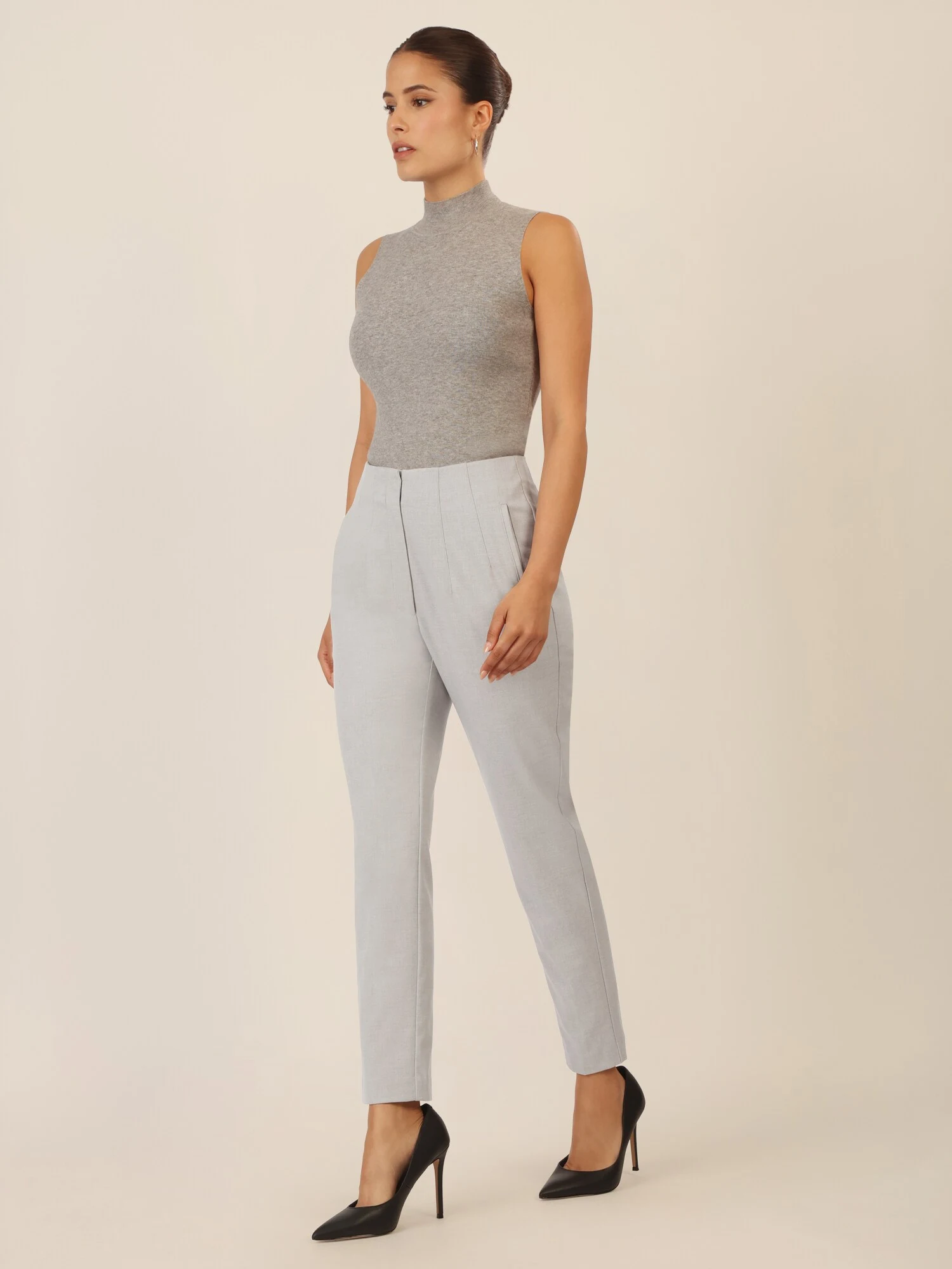 Grey Turtleneck with Grey Tailored Trousers and Black Pumps