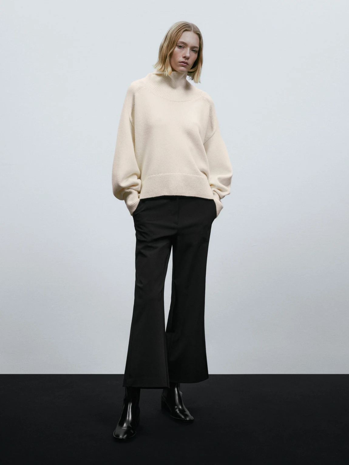 Cream Turtleneck with Black Wide-leg Trousers and Black Heeled Ankle Boots