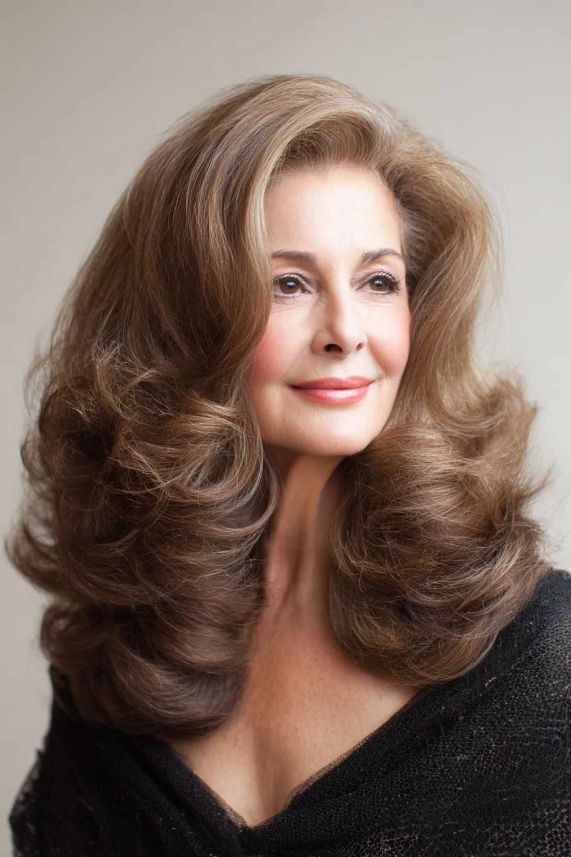 50 Voluminous Winter Blowout Hairstyles for Women Over 50 for Workdays That Are Chic, Polished and Easy to Wear 2 Voluminous Crown Blowout for the Office