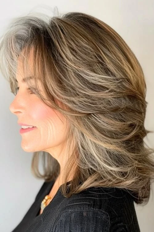 50 Voluminous Winter Blowout Hairstyles for Women Over 50 for Workdays That Are Chic, Polished and Easy to Wear 28 Voluminous Blowout With Feathered Ends