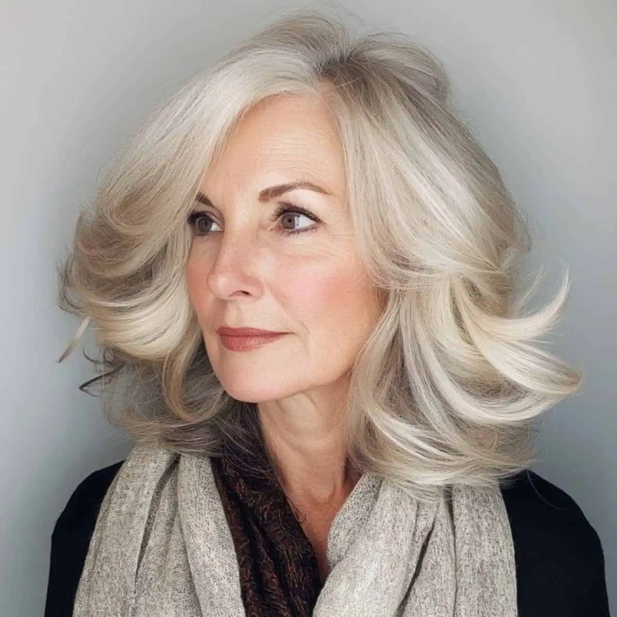 50 Voluminous Winter Blowout Hairstyles for Women Over 50 for Workdays That Are Chic, Polished and Easy to Wear 38 Voluminous Blowout With an Ash Blonde Tone