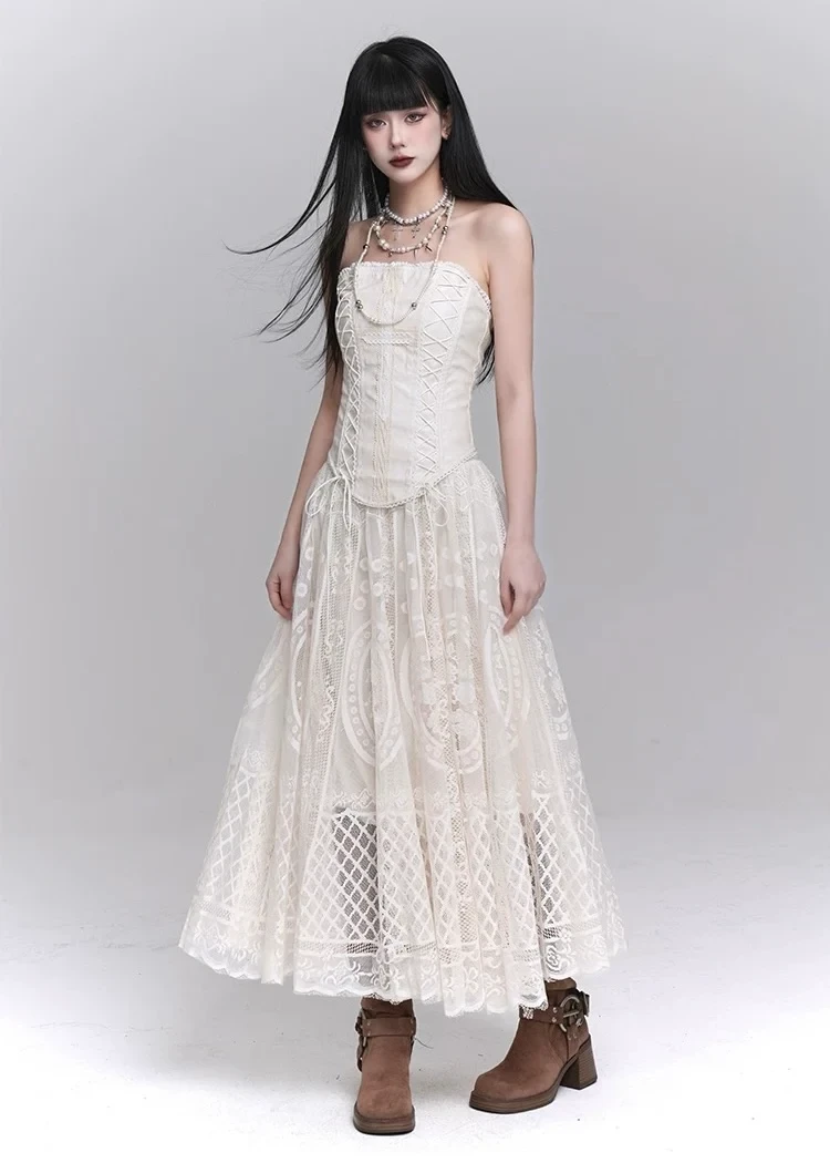 Cream lace A-line dress with suede ankle boots and a pearl bracelet
