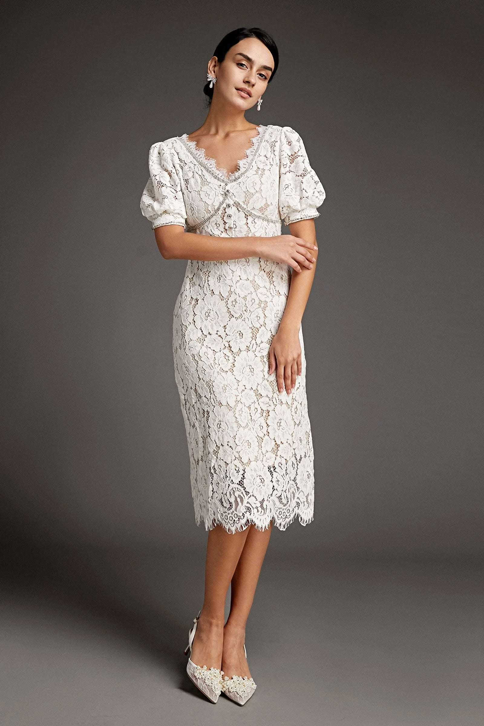 Soft white lace midi dress with pointed mules and statement earrings