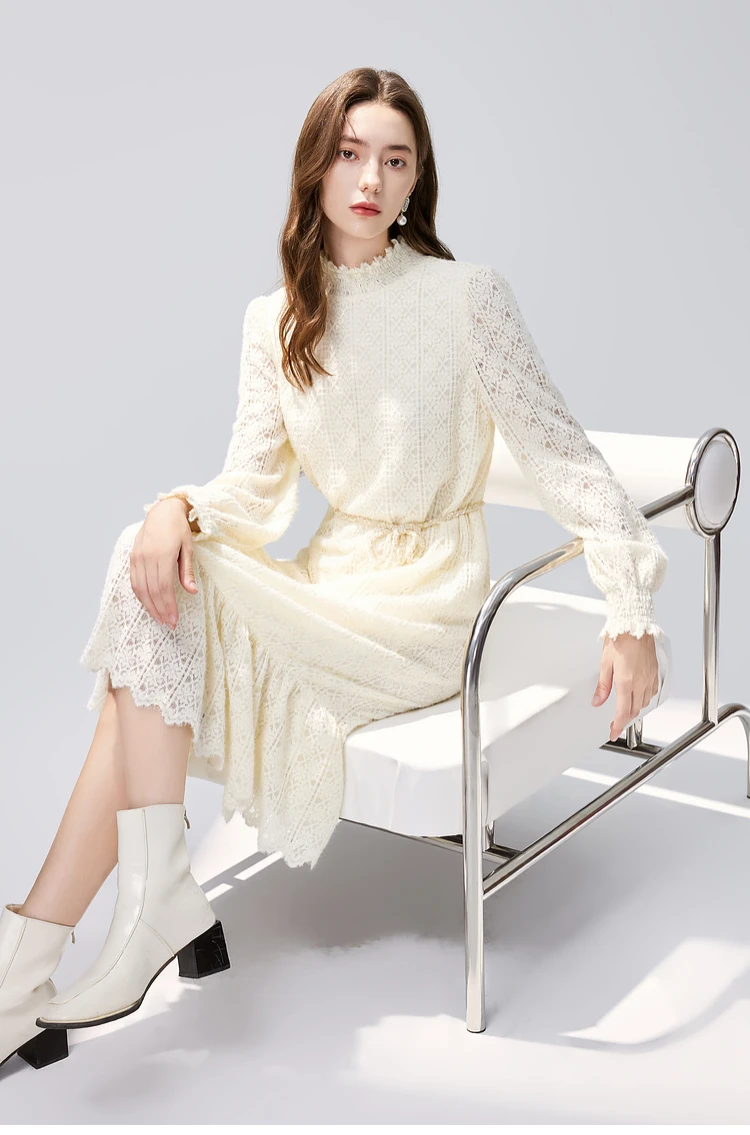 Ivory lace long-sleeve dress with block-heel ankle boots and a slim leather belt