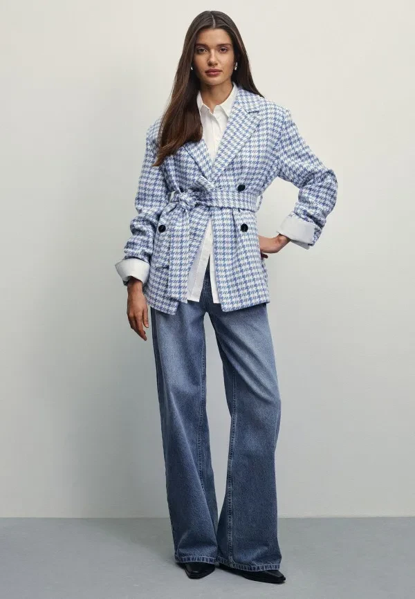 Belted check jacket with high-waisted jeans