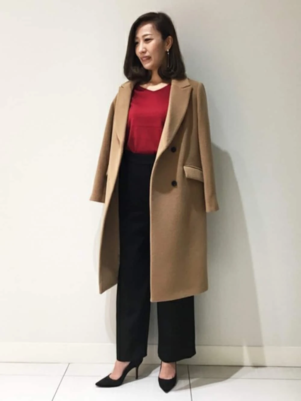 Camel Wool Coat with a Red Blouse and Black Trousers and Black Heels for a Bold Office Day