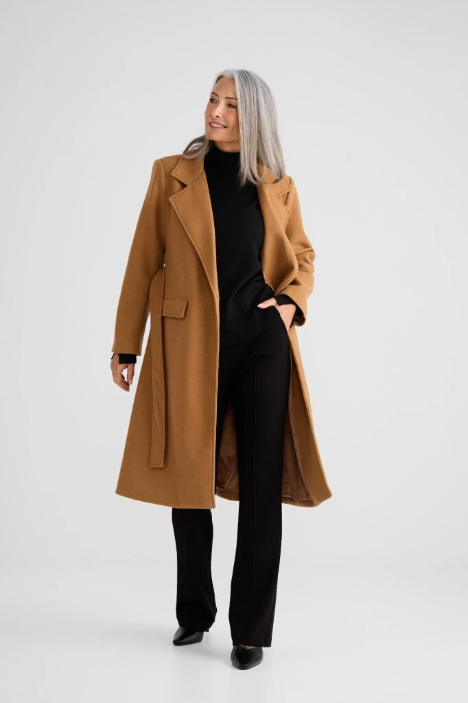 Camel Wool Coat with Black Trousers and Black Shoes for a Festive Office Day