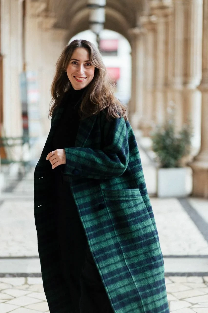 22 Checked Wool Coat Outfits for Women Over 40 for Winter Travel That Are Smart, Warm and Effortless 15 Green Checked Wool Coat with Black Trousers and Black Boots for a Lakeside Winter Trip