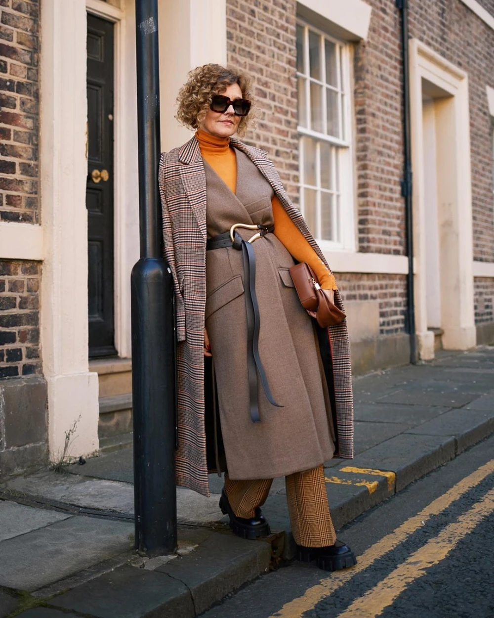 22 Checked Wool Coat Outfits for Women Over 40 for Winter Travel That Are Smart, Warm and Effortless 18 Checked Wool Coat with a Grey Dress and Black Shoes for a Rustic Winter Trip