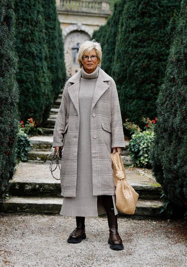 22 Checked Wool Coat Outfits for Women Over 40 for Winter Travel That Are Smart, Warm and Effortless 23 Checked Wool Coat with a Grey Dress and Brown Boots for a Calm Winter Getaway