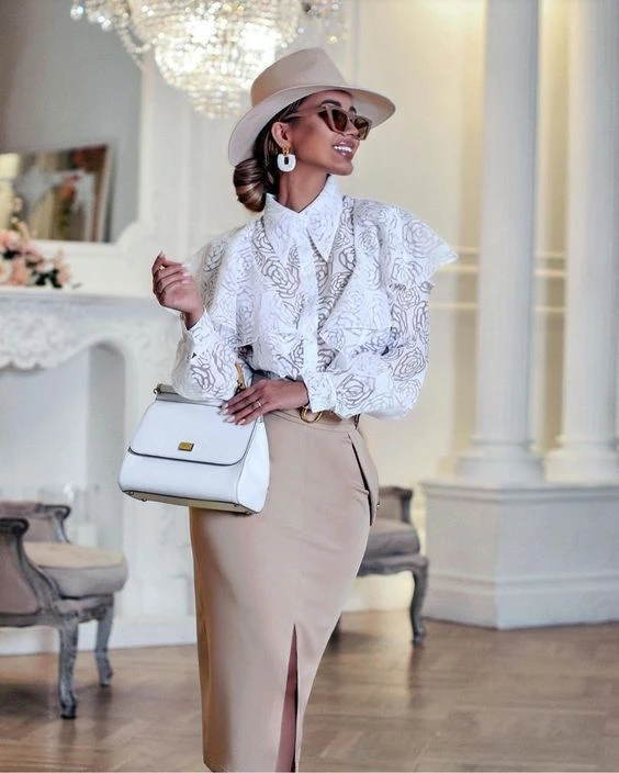 White lace blouse and pencil skirt outfit with smart loafers and a small structured clutch