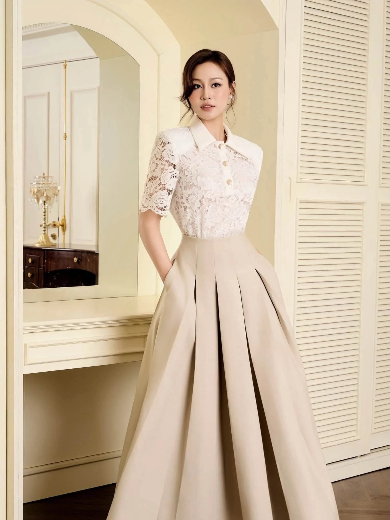 Champagne lace blouse and pleated skirt outfit with pointed mules and statement earrings