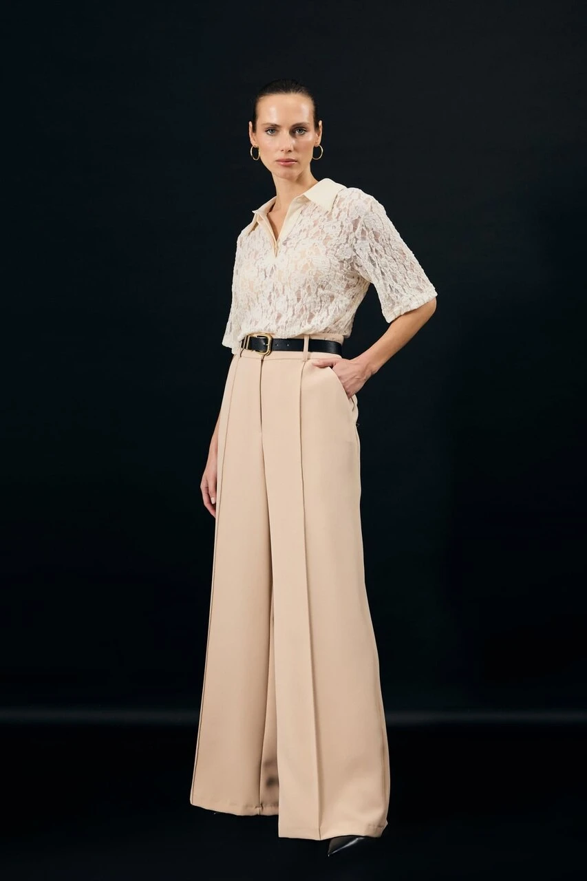 Champagne lace blouse and trouser outfit with smart loafers and silver drop earrings