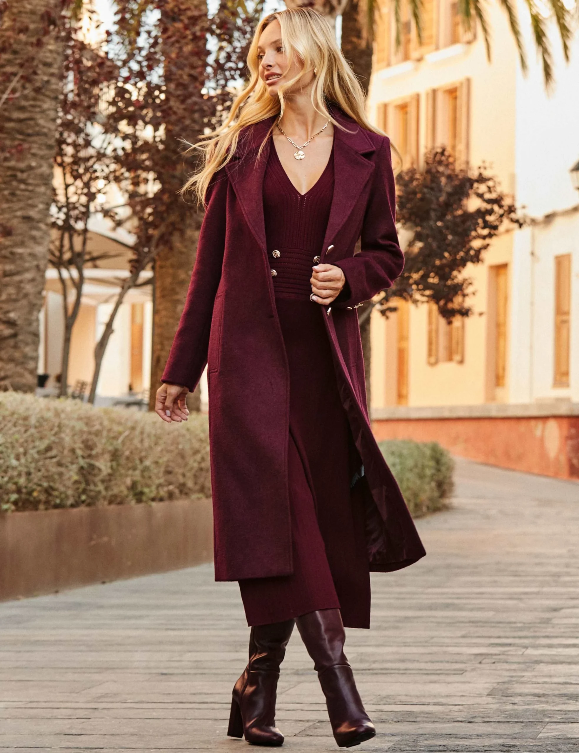 30 Long Wool Coat Outfits with Boots for Women Over 40 for Cold Walks That Are Warm, Smart and Effortless 3 Long Burgundy Wool Coat with a Burgundy Dress and Burgundy Boots for a Winter Park Walk