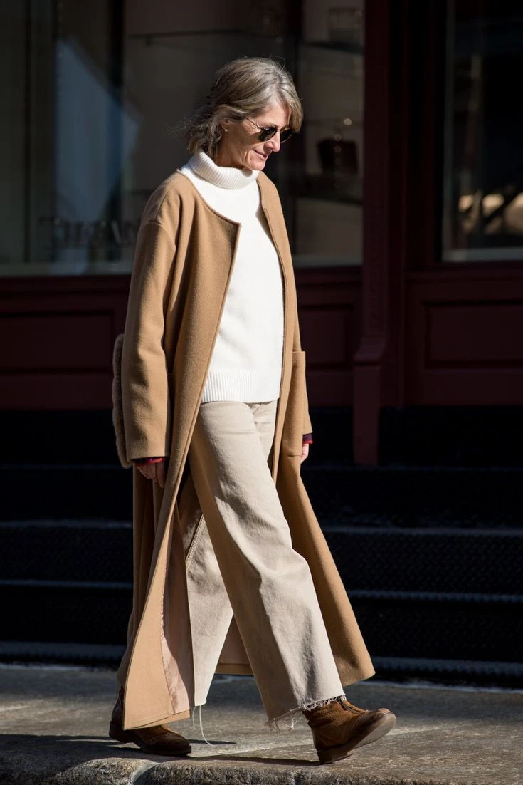 30 Long Wool Coat Outfits with Boots for Women Over 40 for Cold Walks That Are Warm, Smart and Effortless 20 Long Camel Wool Coat with Beige Trousers and Brown Boots for a Light Winter Walk