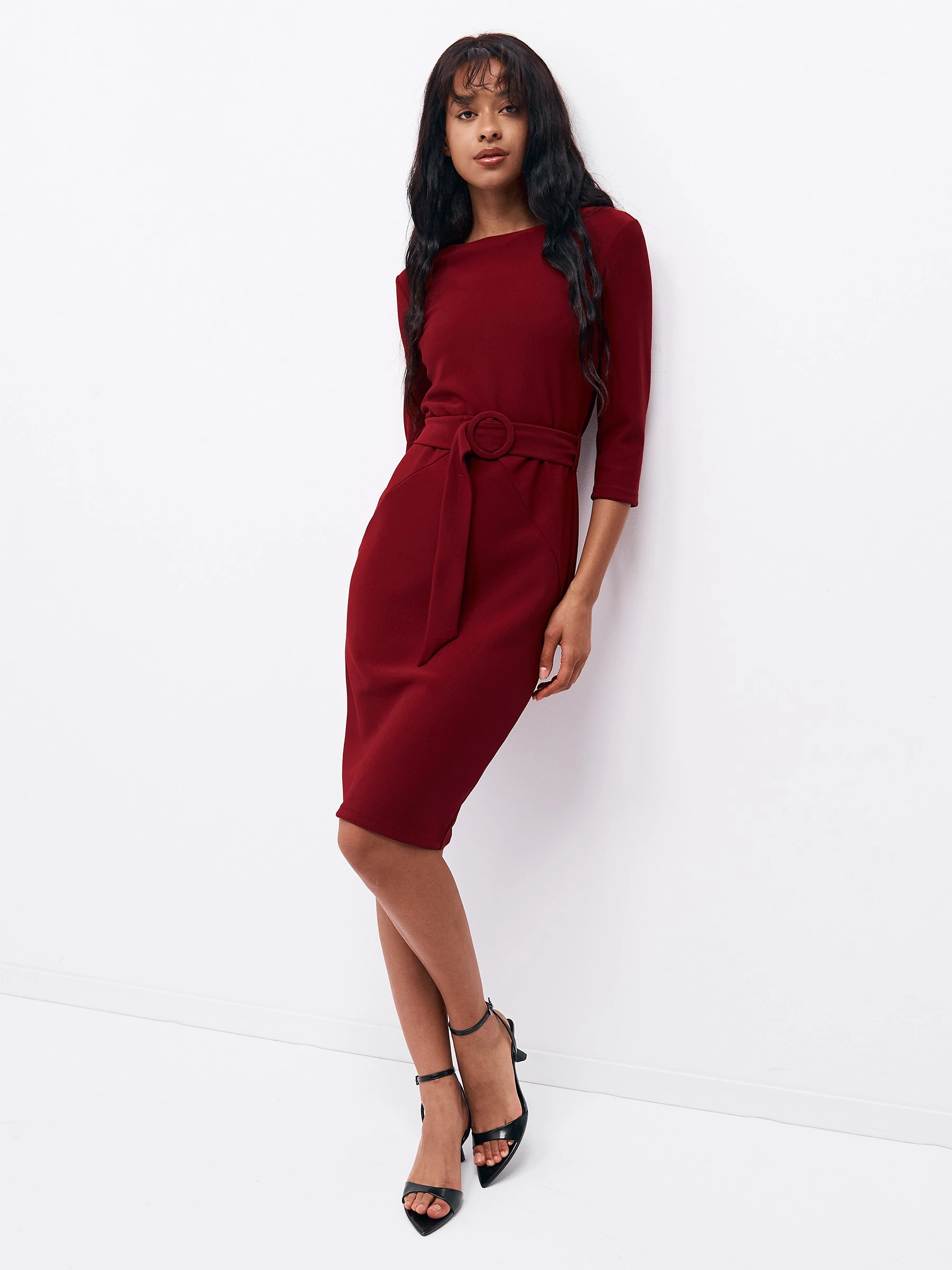 Wine red knee-length dress with elegant pointed flats and a slim leather belt