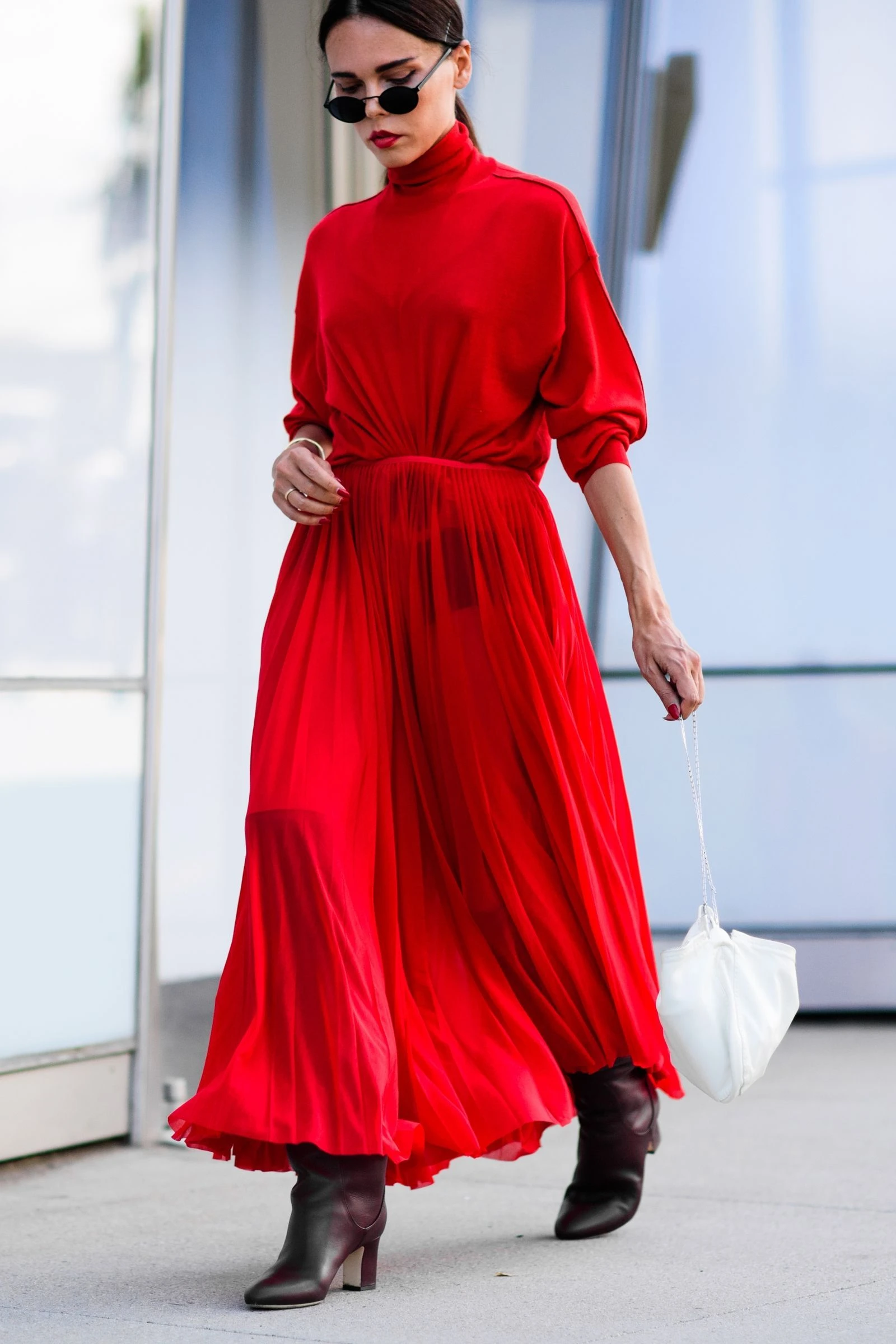 Scarlet pleated midi dress with suede ankle boots and statement earrings