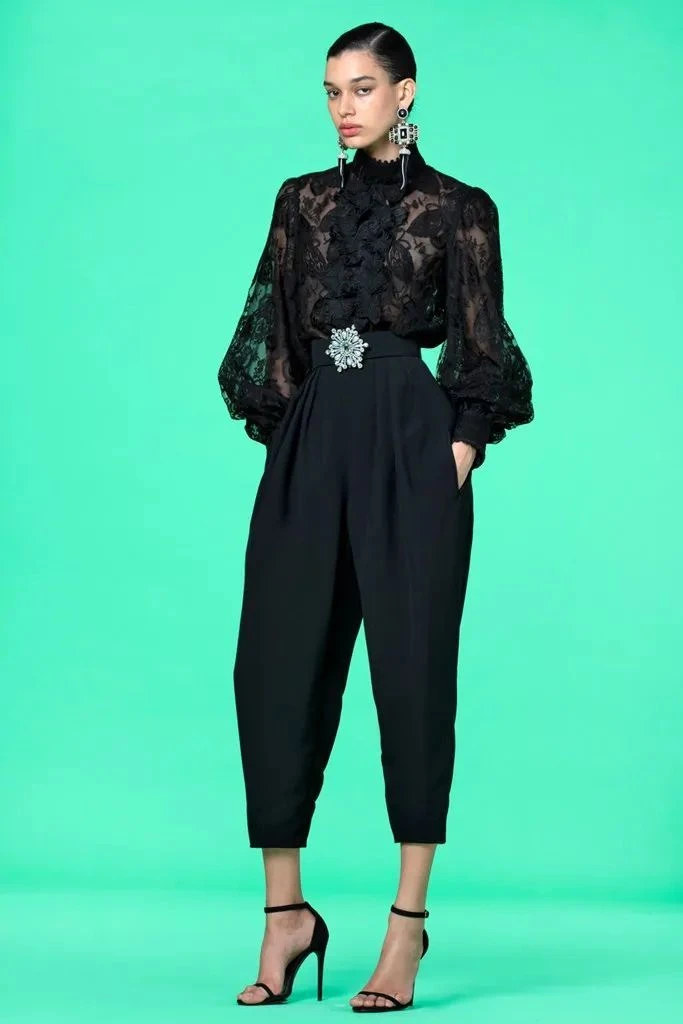 40 Women Over 50 Lace Blouse Outfits for Romantic Dinners That Are Chic, Romantic and Easy to Wear 5 Black lace blouse and trouser outfit with low-heeled pumps and silver drop earrings