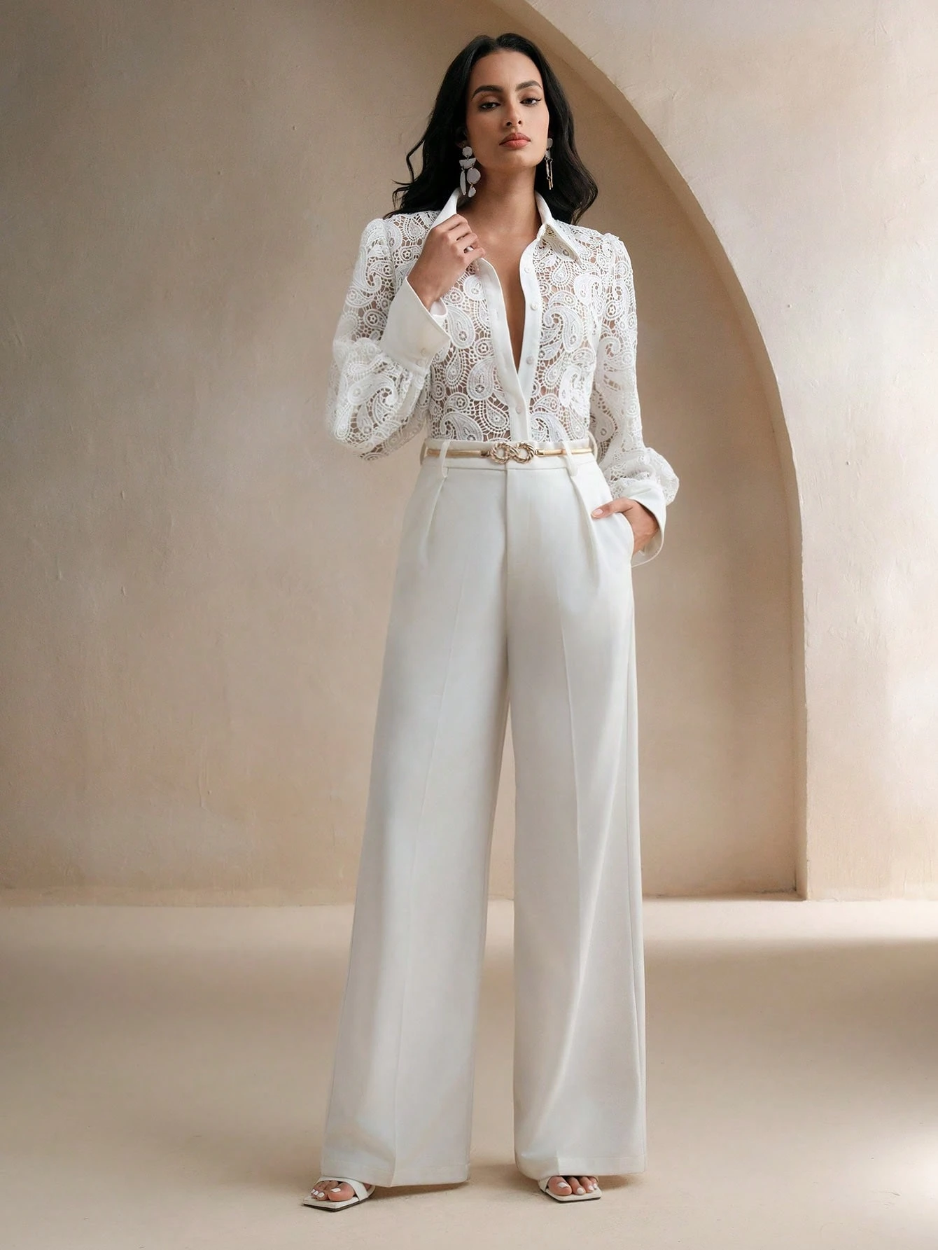 40 Women Over 50 Lace Blouse Outfits for Romantic Dinners That Are Chic, Romantic and Easy to Wear 8 White lace blouse and wide-leg trouser outfit with low-heeled pumps and a slim leather belt