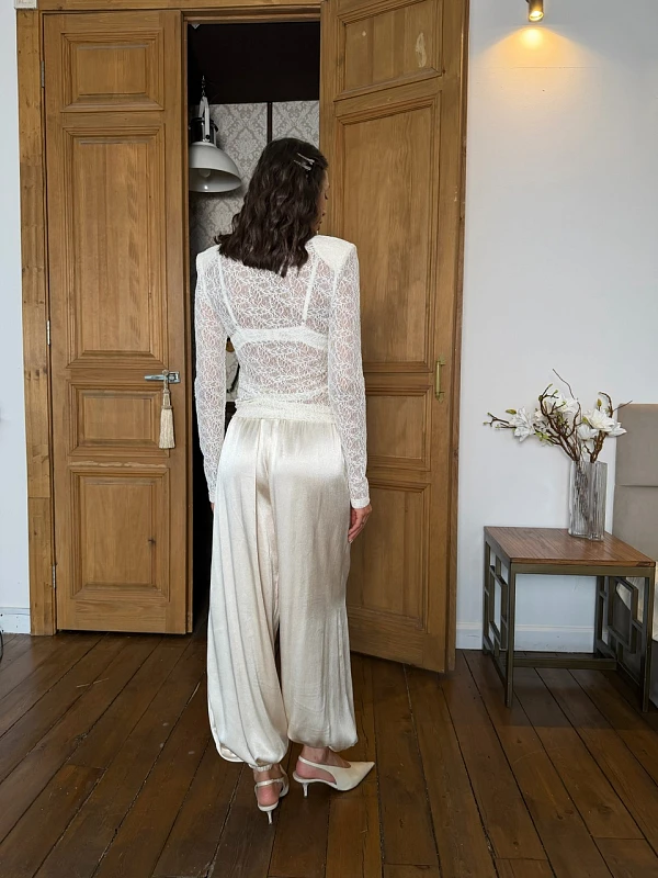 40 Women Over 50 Lace Blouse Outfits for Romantic Dinners That Are Chic, Romantic and Easy to Wear 15 White lace blouse and satin trouser outfit with pointed mules and a silk scarf