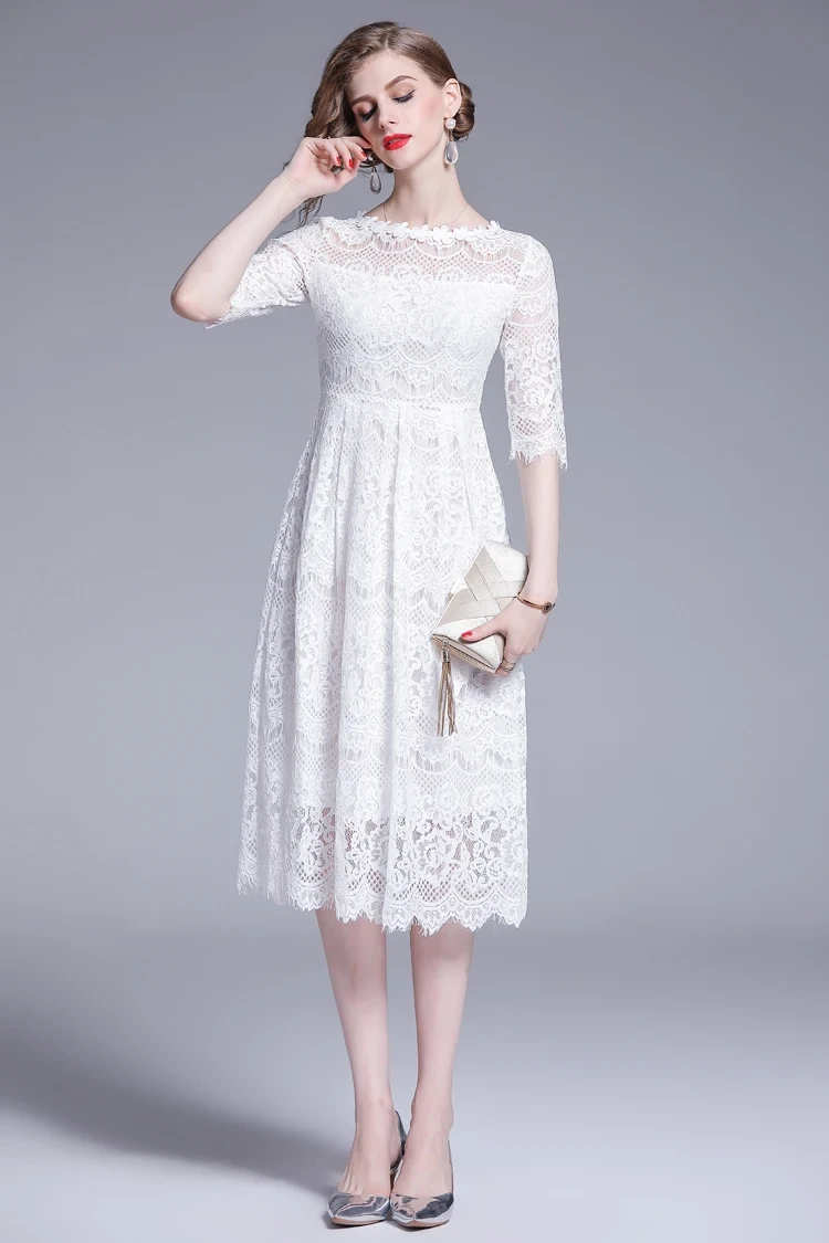 Ivory lace A-line dress with low-heeled pumps and a small structured clutch