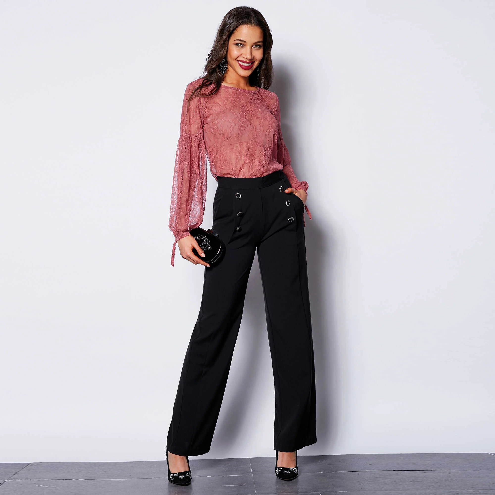 38 Women Over 50 Lace Top and Trouser Outfits for February Evenings That Are Chic, Romantic and Easy to Wear 20 Blush lace top and evening trouser outfit with black pointed heels and a small structured clutch